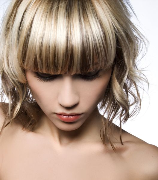Highlighted Blonde Woman With Short Straight Bangs ISA Professional