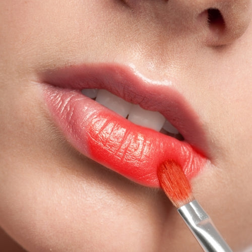 Woman Applying Tinted Lip Balm- ISA Professional
