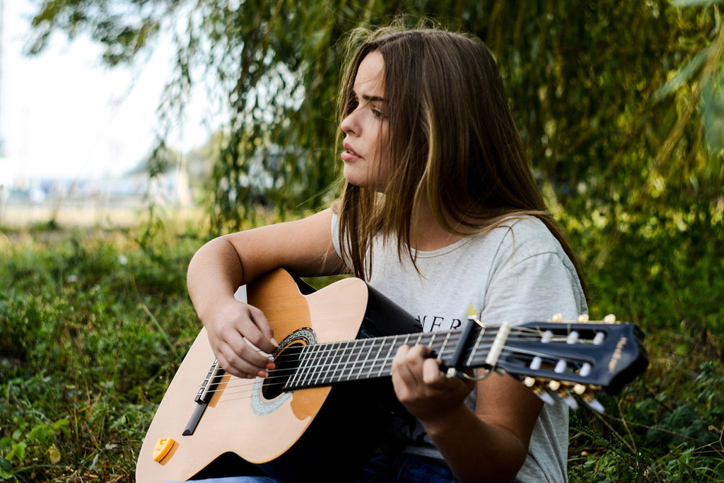 girl playing the guitar