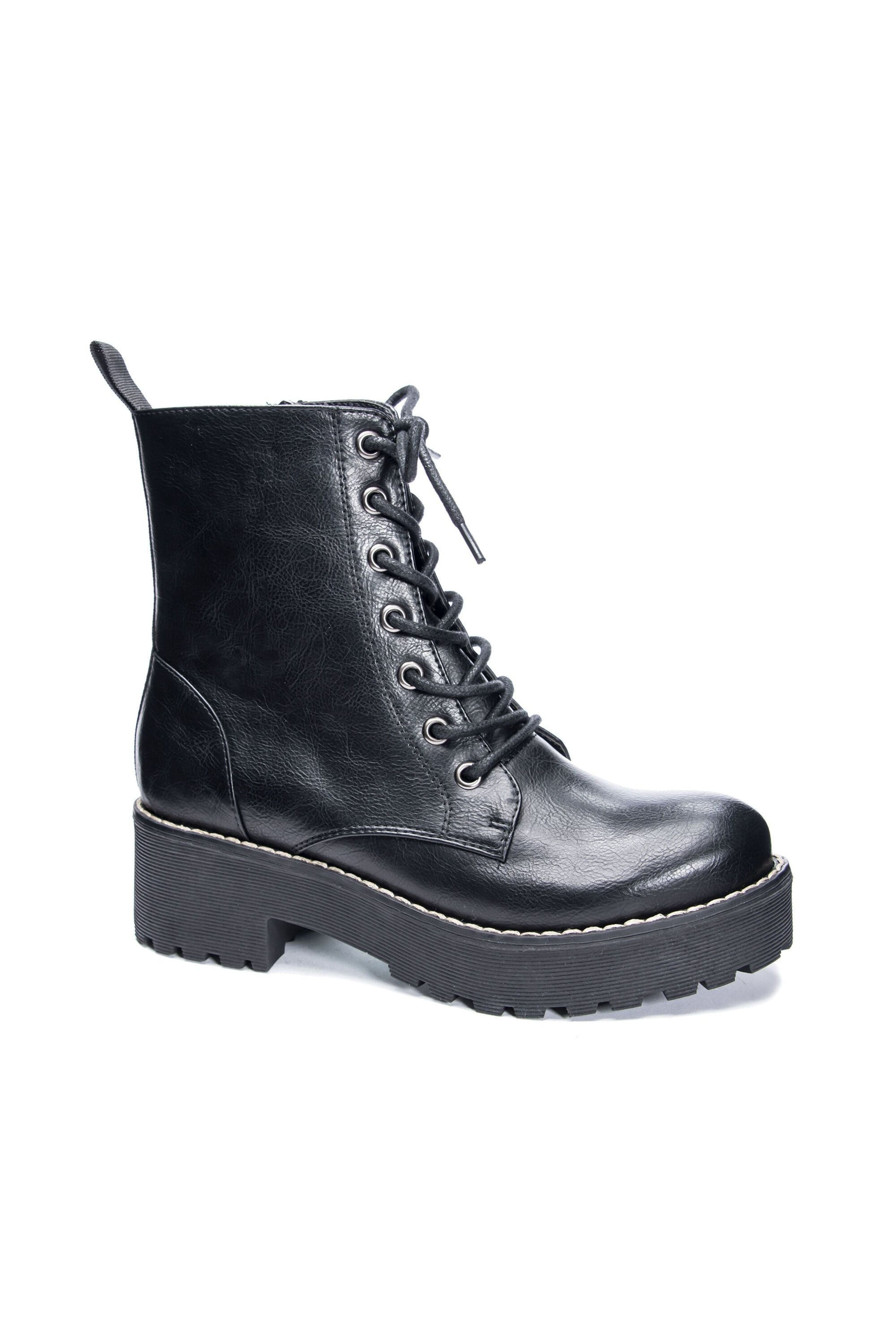 white and black combat boots