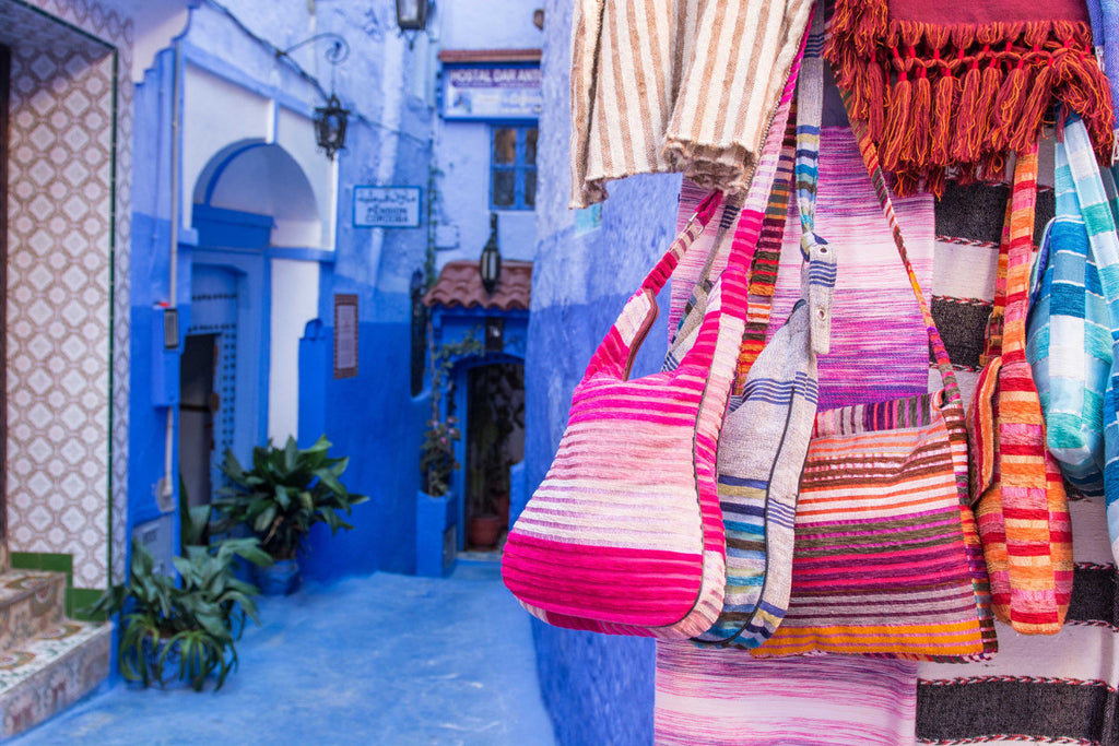 Street Scenes in Chefchaouen, Morocco by Sophee Smiles - Bags Hanging on Stall