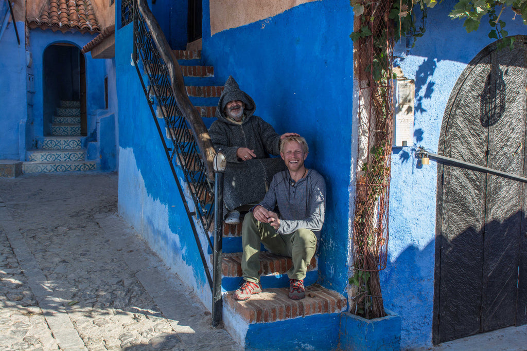 Street Scenes in Chefchaouen, Morocco by Sophee Smiles - Hooded Old Man & Ben Southall on Blue Stairs