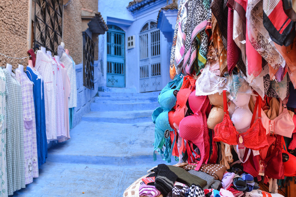 Street Scenes in Chefchaouen, Morocco by Sophee Smiles - Bras Hanging on Stall