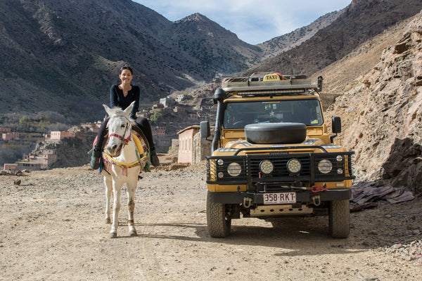Sophee Smiles - At Home in Morocco - Sophee on Horse With Landrover