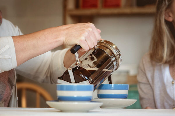 pouring a cafetiere of coffee