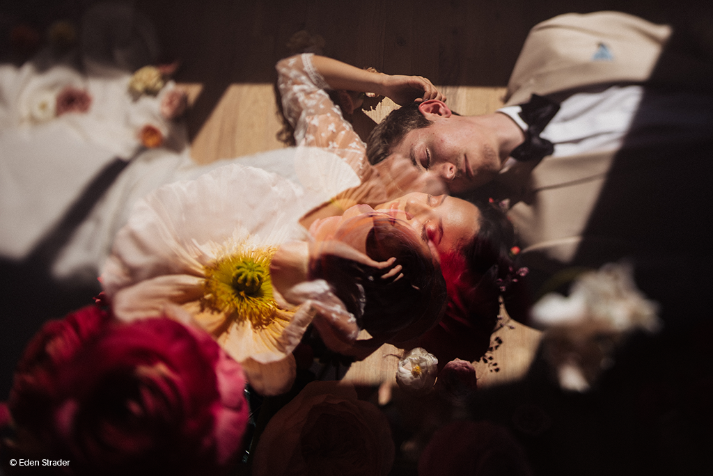 eden strader photo of couple laying on the ground 