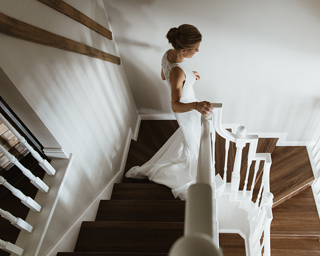 Chelsea Fabrizio photography image of bride walking down stairs 