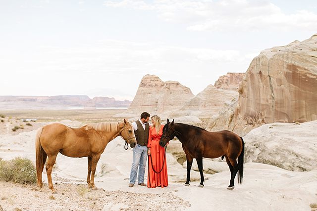 Image of couple with two brown horses in southern utah by Jessica Parker 
