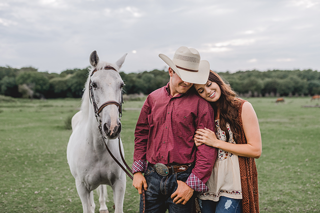 Image by McKenzie Deakins of couple with horse for engagements 