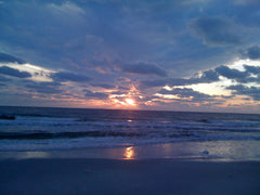 Blue clouds at ocean sunset