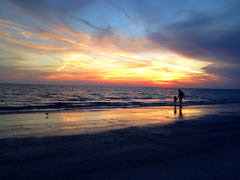Father son at beach with perfect sunset