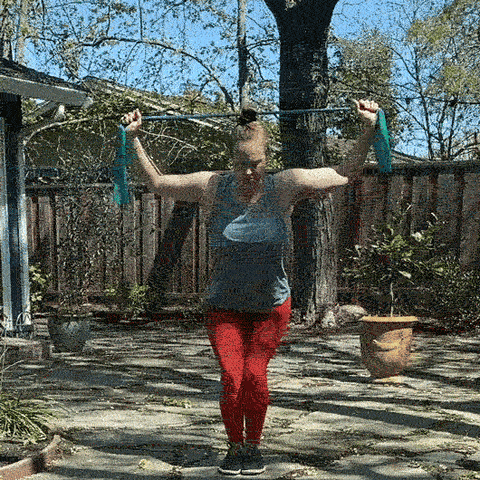Animated gif of Breanna demonstrating the Chair Pose Lateral Pull Down exercise 