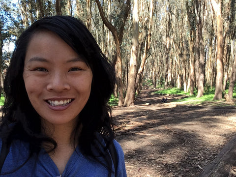 Photo of Rachel selfieing in front of the Woodline in the Presidio