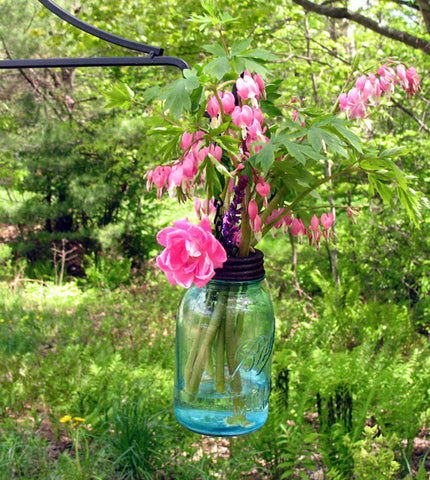 hanging mason jar flower vases with flower frogs for a country inspired outdoor wedding or bridal shower