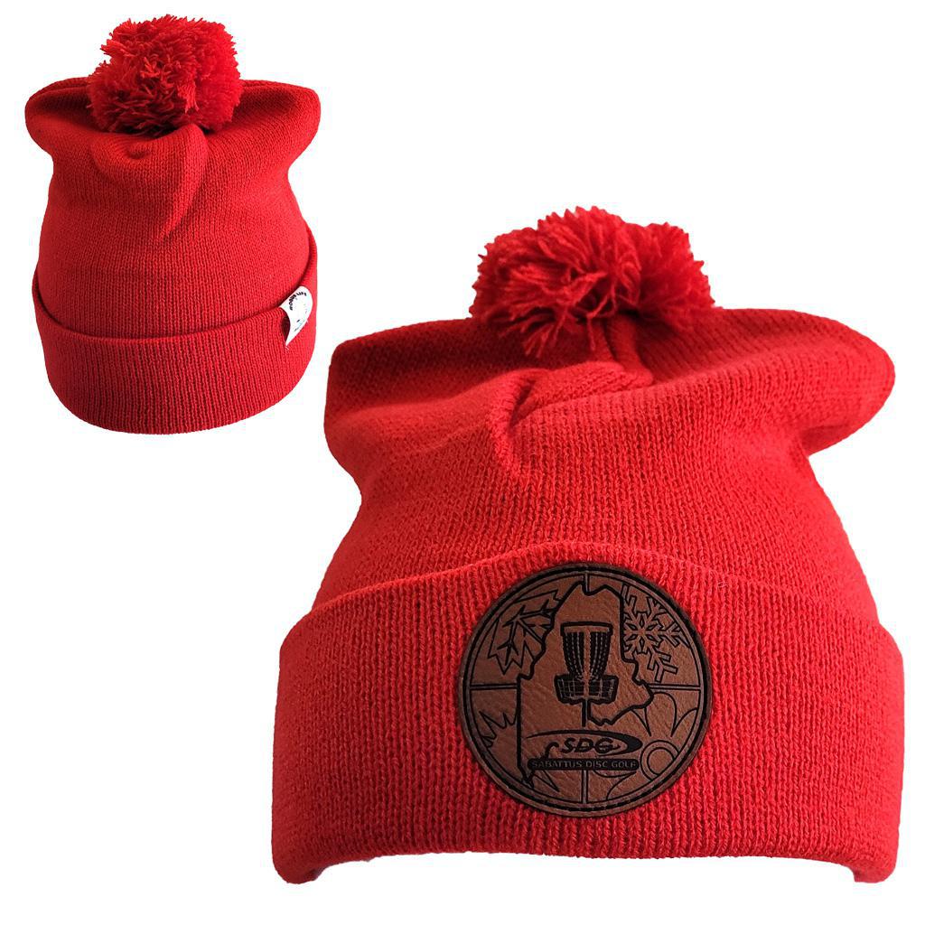 True Red Knit Pom Pom Beaning with SDG trainzwholesale Laser Engraved on leather patch that is sewn to the front of the hat, also a back view of the hat with the Rogue Life Maine logo on a small white tag sewn to the hat rim 