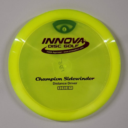 Disc Wall Hanger Disc Golf Accessories with black wall hanger behind yellow disc