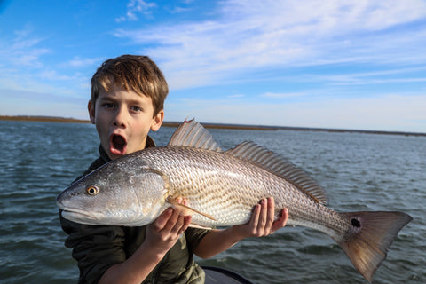 A young angler shows off a beauty caught this week with Captain Tuck Scott 