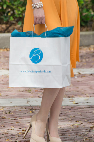 A very stylish girl and her shopping bag in Historic Cocoa Village