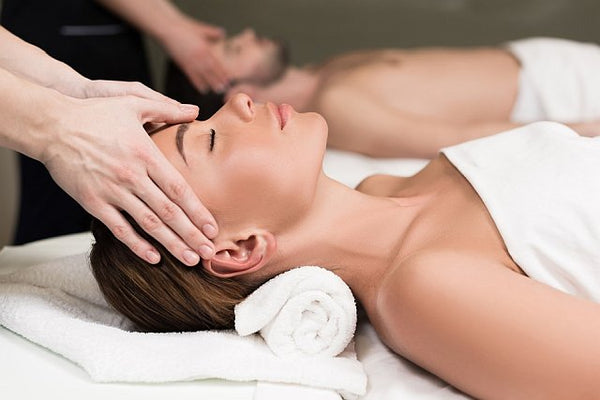 man and woman relaxing having a massage