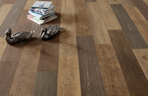 Wooden style floor tiles laid vertically on the floor of a large, modern, Scandi themed living space