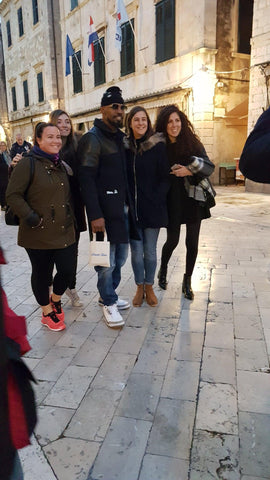 Jamie Foxx on Stradun, Dubrovnik - holding the Break Time bag full of nautical souvenirs, including anchor bracelets