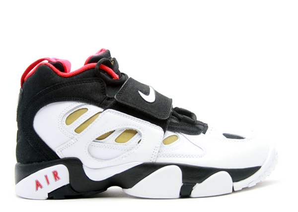 black and gold nike turfs