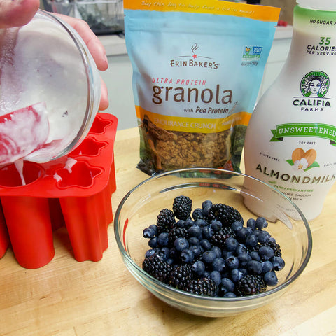 adding yogurt layer to popsicle mold