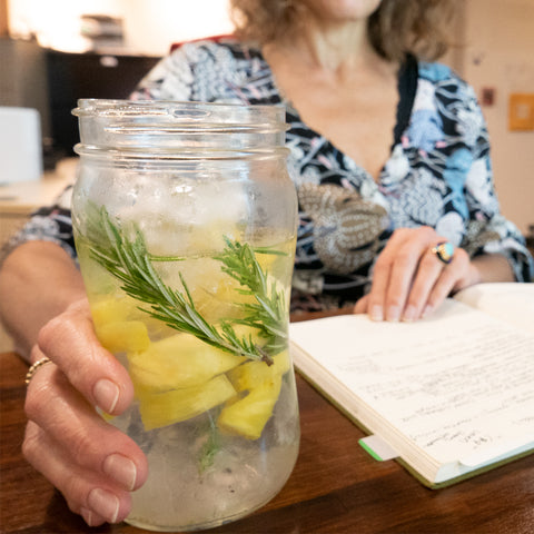 erin drinking lemon rosemary water