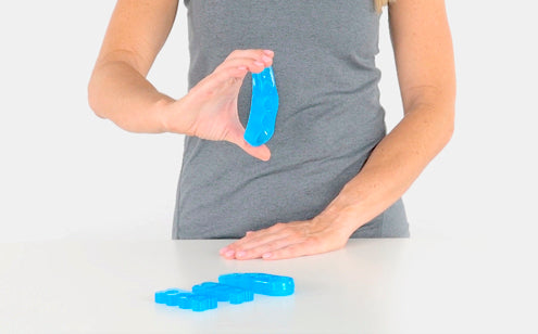 woman bending toe spreaders to show flexibility