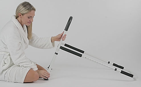woman adjusting the bed rail height