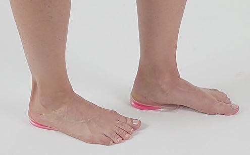 gel heel cups placed under woman's feet