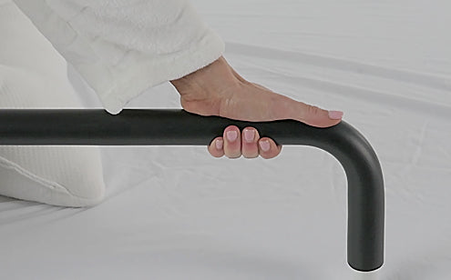 hand placing firm grip on foam padding