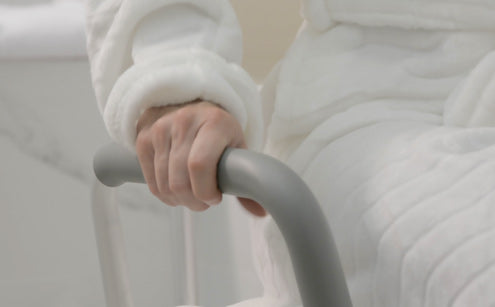 Holding shower chair handle