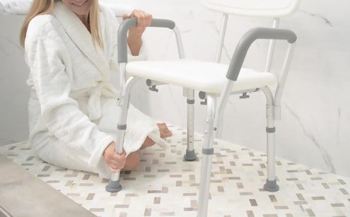 Woman repositioning the leg of the shower chair