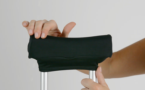 Hand holding crutch pad