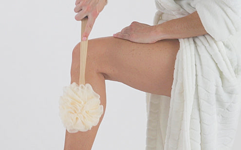 scrubbing leg with loofah