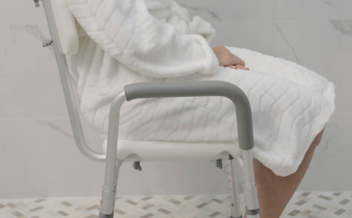 Sitting comfortably with shower chair inside the bathroom