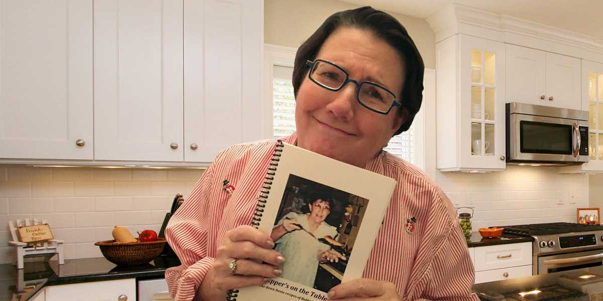 Elderly holding a family cook book