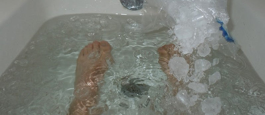 Feet soaked in water and ice
