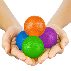 hand holding 4 exercise balls