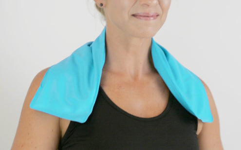 Smiling woman using neck ice pack