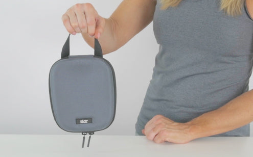 Woman holding blood pressure monitor case