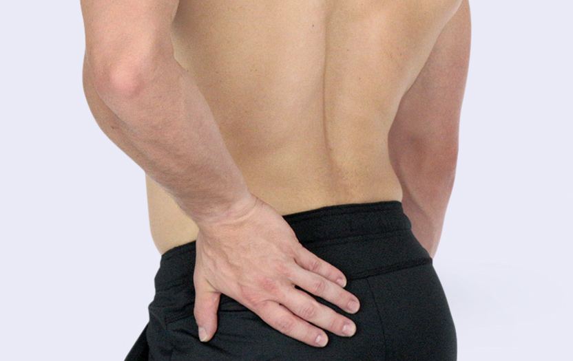 Man holding his lower back