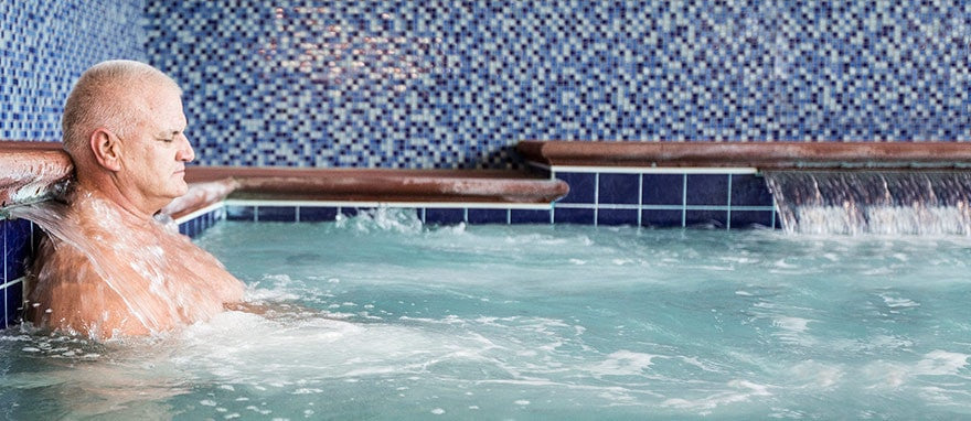 man using hot tub