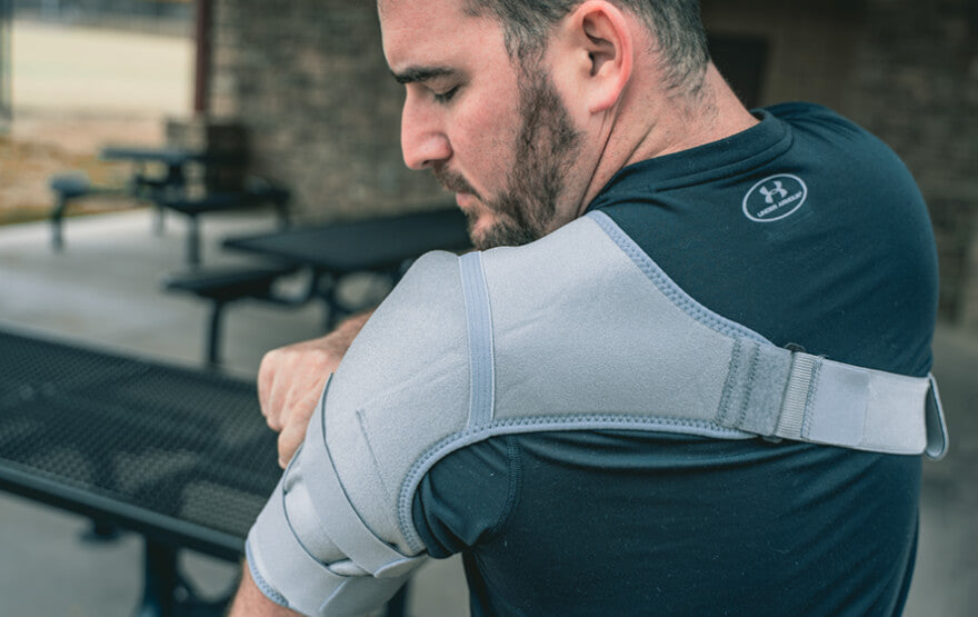 Man adjusting shoulder brace