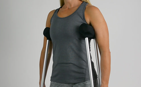Woman using shawl with crutch pad