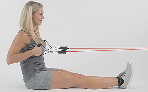 woman exercising arms with resistance bands