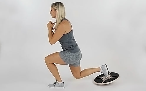 lunge exercise with wooden balance disc