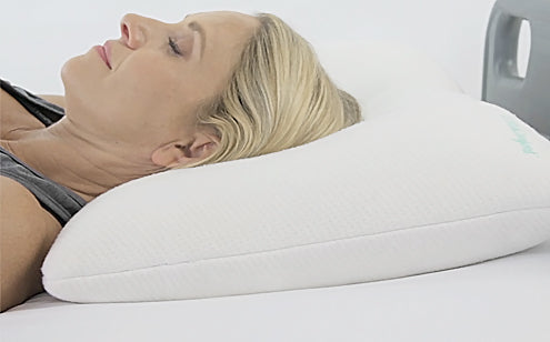 Head of woman in cervical pillow