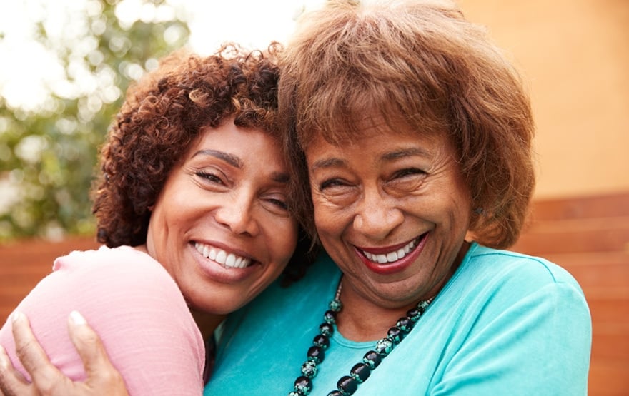 Senior black mum and her middle aged daughter